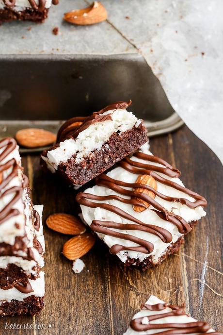 These Almond Joy Brownies have a coconut butter topping and a drizzle of dark chocolate - you'd never guess that these indulgent brownies are gluten-free, refined sugar-free, and Paleo!