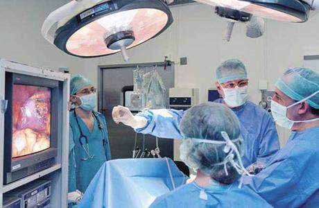 Surgeons at laparoscopy operating room of hospital