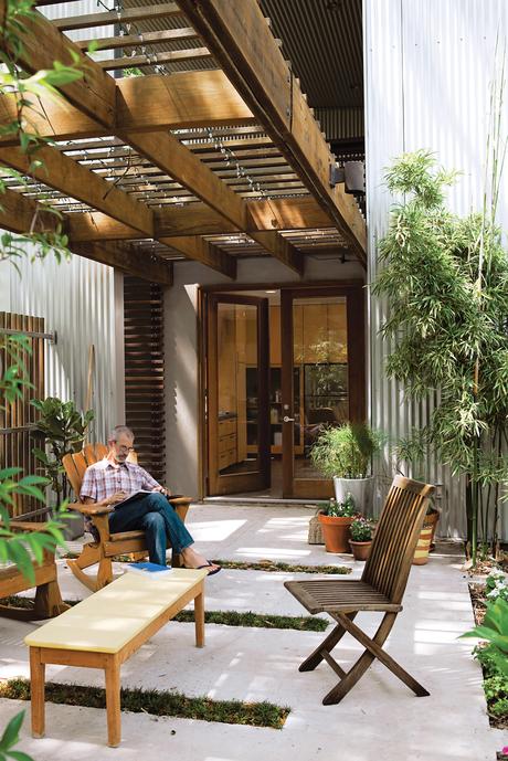 Catovic Hughes’s design for the Morelands is all about embracing the outdoors. Rick spends as much time on the patio as he can. The undulation of the aluminum cladding makes a regular, rhythmic backdrop for the yards-high bamboo he lovingly tends.