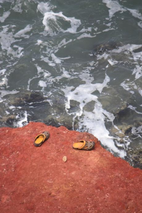 Someone may have been knocked out of their crocs by the waves.