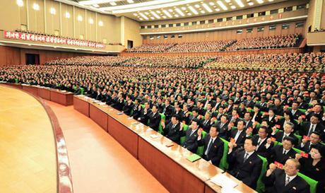 Pyongyang Holds Party Conference Party conference participants hold up their membership credentials during the Pyongyang Party Conference (Photo: Rodong Sinmun).