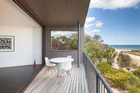 A deck looks out onto the beach in Australia