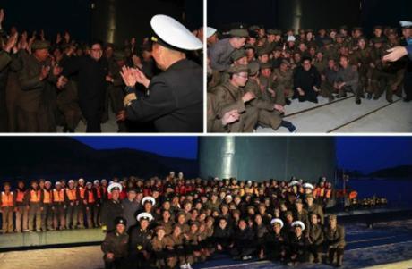 Kim Jong Un greets and poses for a commemorative photo with KPA Navy service members and DPRK defense industry personnel involved in the test firing (Photos: Rodong Sinmun/KCNA).