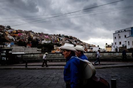 Most of the days in Guanajuato were sunny and sometimes quite warm, but for a few days we got massive storms and snow! Here's a few musicians on the way to work under a dark sky.
