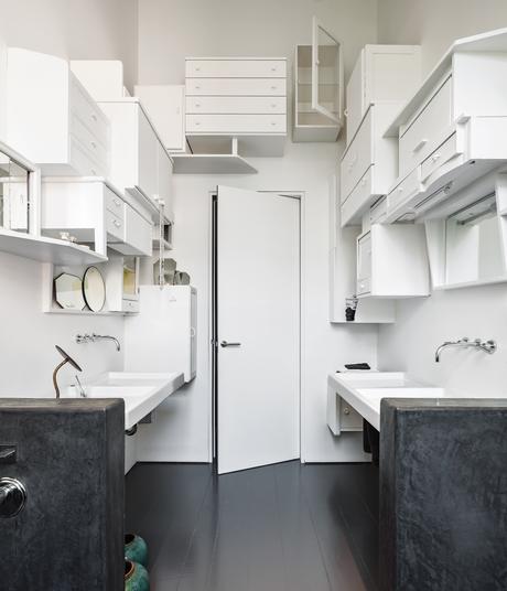 Modern white bathroom with cabinet decorations on wall