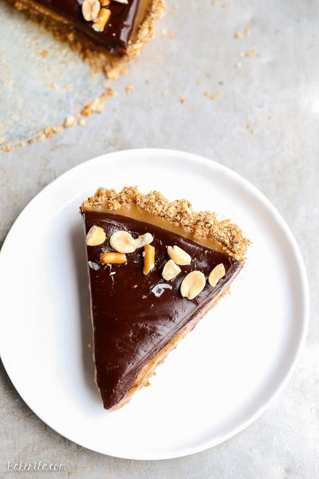 This Chocolate Peanut Butter Tart has a crunchy pretzel crust and smooth peanut butter caramel filling, all topped with luscious chocolate ganache. This recipe is gluten-free and vegan.