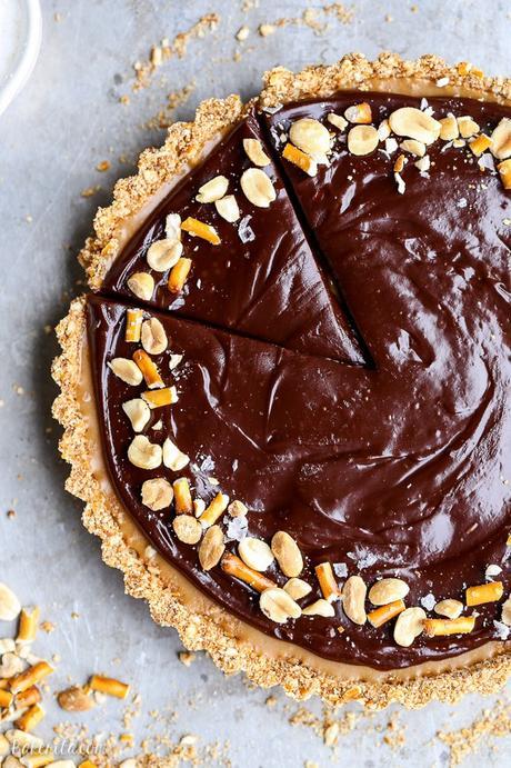 This Chocolate Peanut Butter Tart has a crunchy pretzel crust and smooth peanut butter caramel filling, all topped with luscious chocolate ganache. This recipe is gluten-free and vegan.