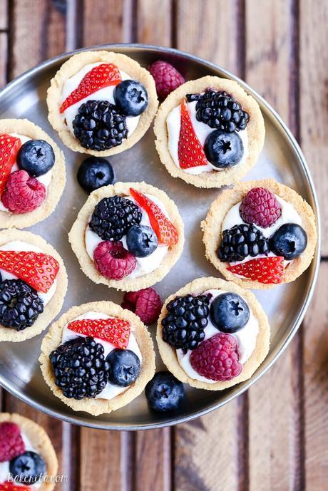 These Mini Berry Tarts have a shortbread crust with coconut cream filling and fresh berries! These sweet dessert bites are Paleo, gluten-free, and vegan.