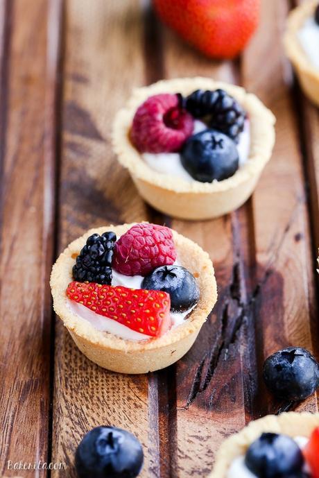 These Mini Berry Tarts have a shortbread crust with coconut cream filling and fresh berries! These sweet dessert bites are Paleo, gluten-free, and vegan.