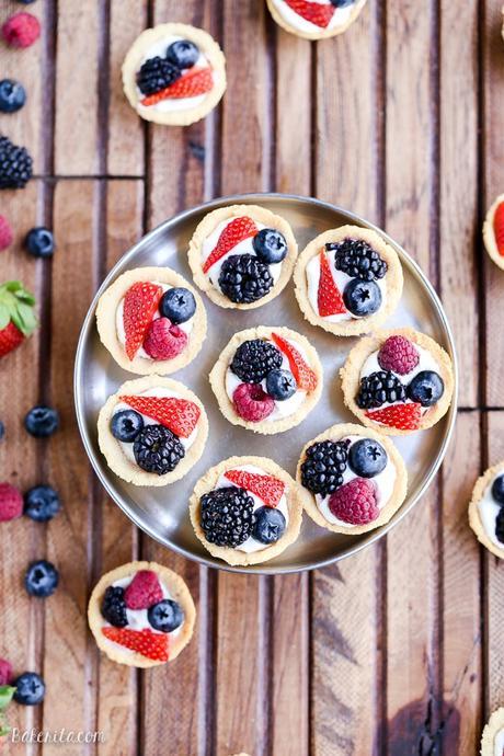 These Mini Berry Tarts have a shortbread crust with coconut cream filling and fresh berries! These sweet dessert bites are Paleo, gluten-free, and vegan.