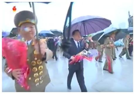 KPA General Political Department Director, WPK Political Bureau Presidium Member and National Defense Commission Vice Chairman Hwang Pyong So and WPK Secretary and WPK Political Bureau Member Choe Ryong Hae deliver floral bouquets to the foot of the Kim Il Sung and Kim Jong Il statues on Mansu Hill on May 3, 2016 (Photo: Korean Central TV).