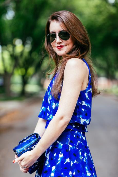 Dallas Blogger, Amy Havins, wears a blue floral print Ivanka trump a-line dress.