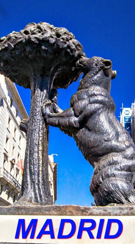 An iconic statue of a bear and a madrone tree (madroño), the heraldic symbol of Madrid, sits in Puerta del Sol, the central square in Madrid, Spain