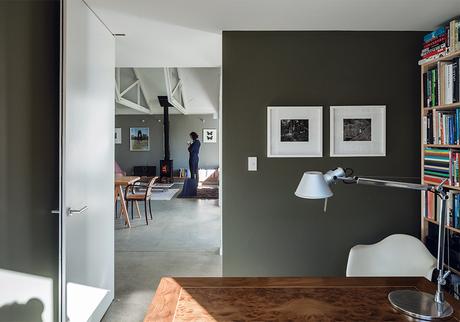 New Zealand office with gray walls and Tolomeo desk lamp from Artemide