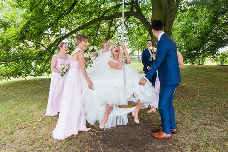 Barmbyfield Barn Wedding tree swing with bride