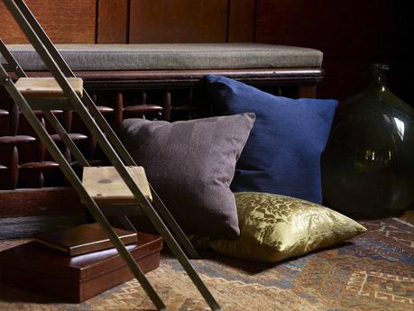 modern grey, blue, and gold pillows by Knoll