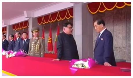 Kim Jong Un talks with WPK Political Bureau Presidium Member and DPRK Premier Pak Pong Ju during the speaking program at a May 10, 2016 rally and parade celebrating the 7th Party Congress (Photo: Korean Central TV).
