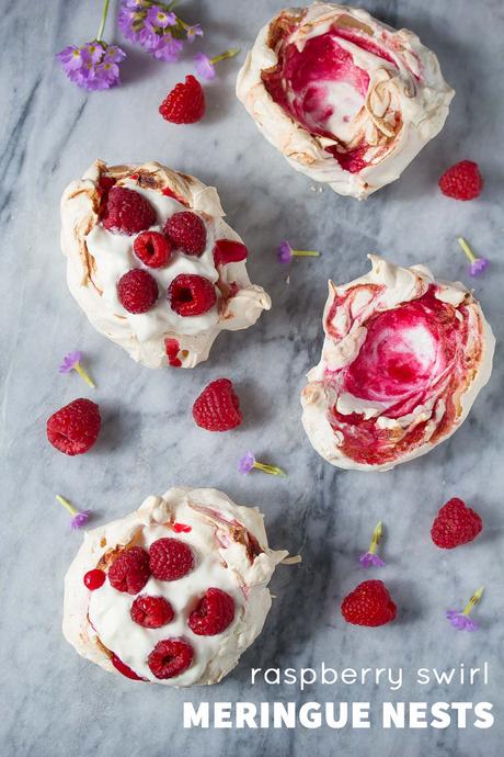 These swirled raspberry meringue nests are topped with whipped cream and fresh berries, are gluten-free, and only 120 calories each! 