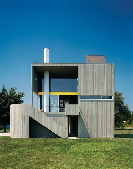 Modern wood-frame home clad in vertical cedar siding 