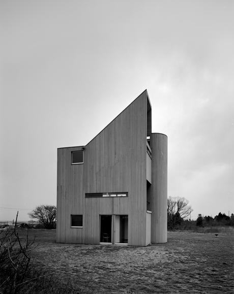 Wood-frame home clad in vertical cedar siding 