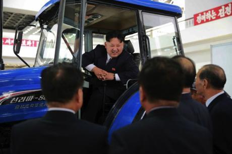 Kim Jong Un sits in a tractor manufactured by the Ku'mso'ng Tractor Plant in Chagang Province whilse touring an exhibition on machines and equipment (Photo: Rodong Sinmun).