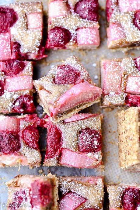 These Raspberry Rhubarb Almond Bars have an crisp almond-flour crust topped with soft almond frangipane, fresh raspberries, and tart rhubarb. This recipe is Paleo, gluten free + refined sugar free.