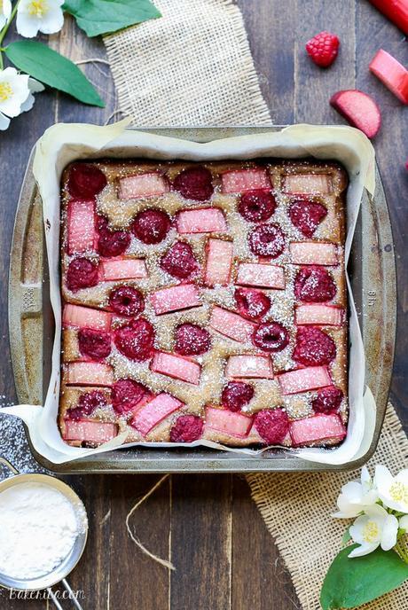 These Raspberry Rhubarb Almond Bars have an crisp almond-flour crust topped with soft almond frangipane, fresh raspberries, and tart rhubarb. This recipe is Paleo, gluten free + refined sugar free.