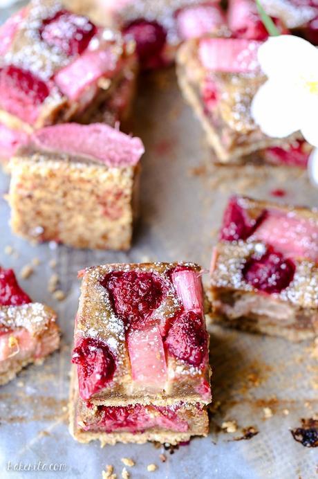 These Raspberry Rhubarb Almond Bars have an crisp almond-flour crust topped with soft almond frangipane, fresh raspberries, and tart rhubarb. This recipe is Paleo, gluten free + refined sugar free.