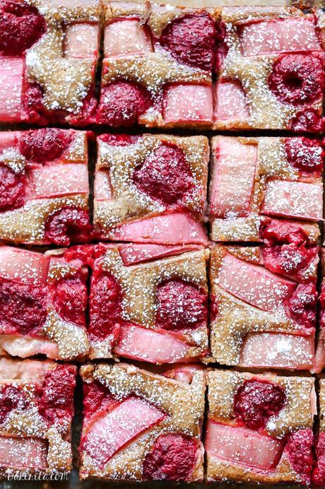 These Raspberry Rhubarb Almond Bars have an crisp almond-flour crust topped with soft almond frangipane, fresh raspberries, and tart rhubarb. This recipe is Paleo, gluten free + refined sugar free.