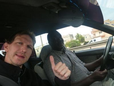 Visting A Pink Lake! : My Trip to Lac Rose in Senegal Papa M'Bye my driver and I
