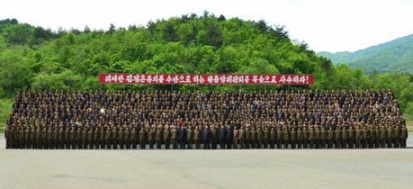 Commemorative photograph of Kim Jong Un with employees and officials of a machine plant managed by Ho Chol Yong (Photo: Rodong Sinmun).