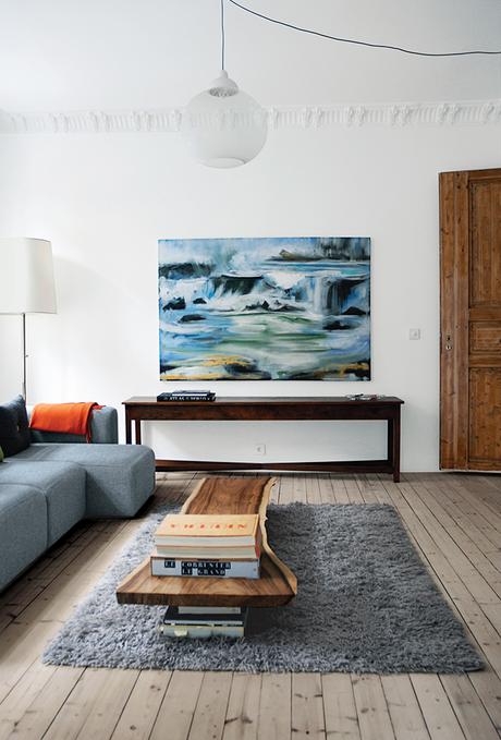 Living room with light wood floors and coffee table made from hardwood slab