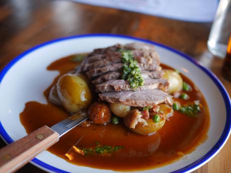 Lamb rump, pancetta, chorizo, Peas & baby onions with thyme roast potatoes