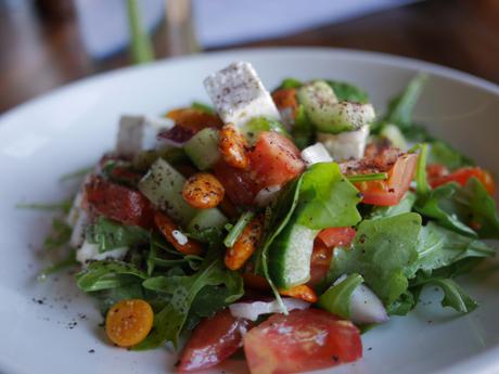 Plough greek salad, cape gooseberry, tomato, cucumber, feta & rocket with harissa almonds, honey & sumac dressing