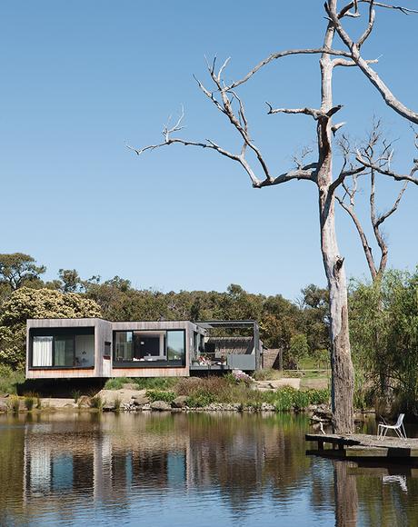 modern lakeside home in Australia with teak facade