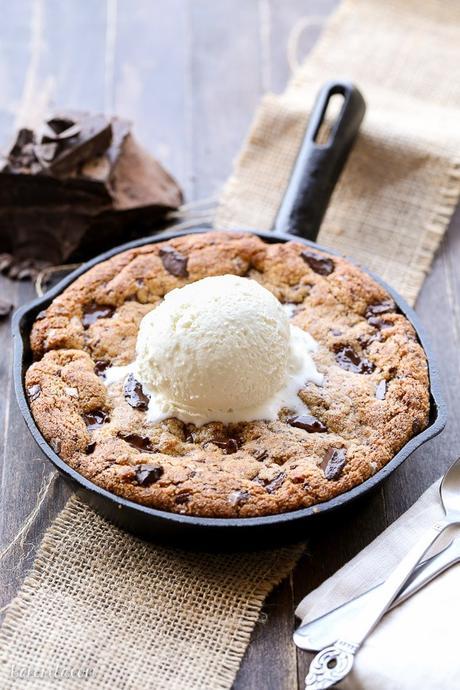 This Paleo Chocolate Chip Skillet Cookie is the ultimate gooey dessert! This gluten free and refined sugar free skillet cookie is a healthier alternative to the classic Pizookie. Use big chocolate chunks to make it extra chocolatey!