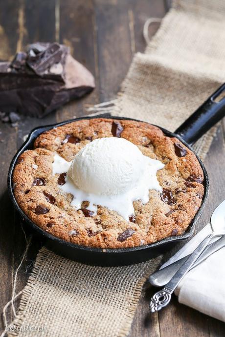 This Paleo Chocolate Chip Skillet Cookie is the ultimate gooey dessert! This gluten free and refined sugar free skillet cookie is a healthier alternative to the classic Pizookie. Use big chocolate chunks to make it extra chocolatey!