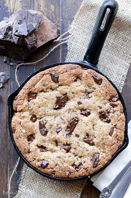 This Paleo Chocolate Chip Skillet Cookie is the ultimate gooey dessert! This gluten free and refined sugar free skillet cookie is a healthier alternative to the classic Pizookie. Use big chocolate chunks to make it extra chocolatey!