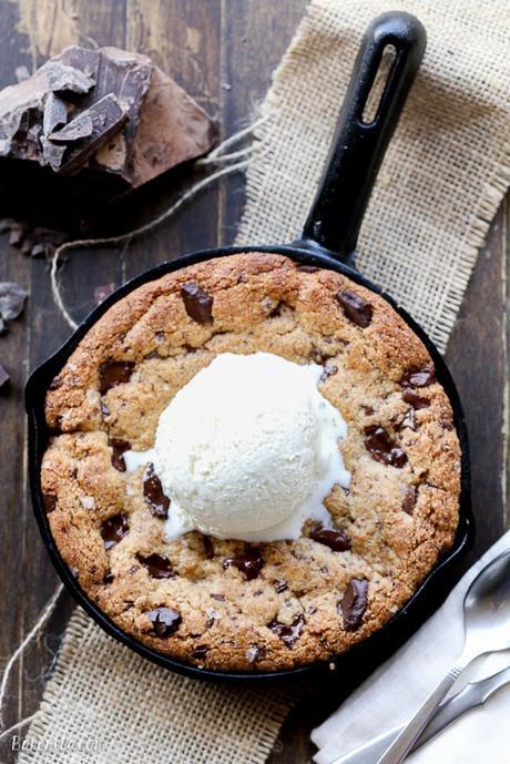 This Paleo Chocolate Chip Skillet Cookie is the ultimate gooey dessert! This gluten free and refined sugar free skillet cookie is a healthier alternative to the classic Pizookie. Use big chocolate chunks to make it extra chocolatey!