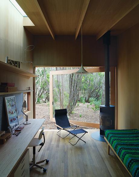 Australian studio with open glass door and wood-burning stove