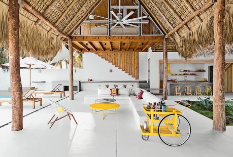 modern beach house thatch roof living dining bar cart