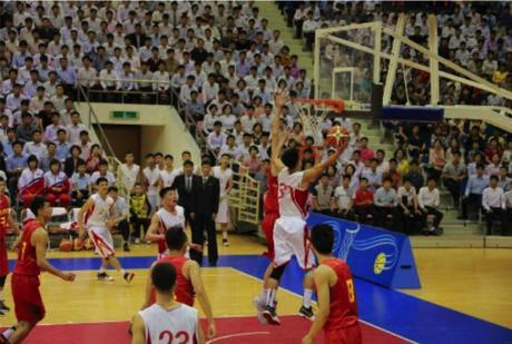 A member of the Sobaeksu Team attempts a layup during a game between the Sobaeksu and Chinese Olympic Teams (Photo: Rodong Sinmun).