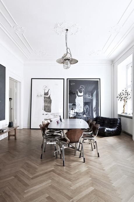 Parisian DIning Room With Statement Photographs And Herringbone Flooring