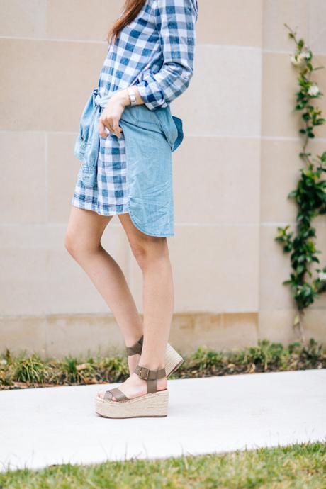 Amy Havins wears a buffalo print shirtdress.