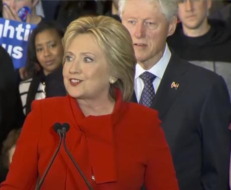 A frail Bill Clinton behind a manic-looking Hillary on Iowa Caucus night, Feb. 1, 2016.
