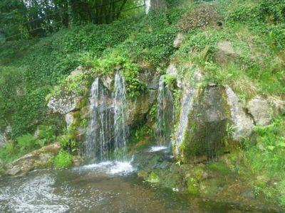 Kissing the Blarney Stone in County Cork, Republic of Ireland A waterfall at Blarney Castle and Gardens