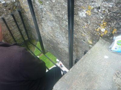 Kissing the Blarney Stone in County Cork, Republic of Ireland The person in front kissing the Blarney Stone