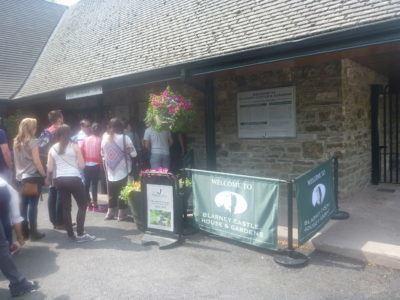 Kissing the Blarney Stone in County Cork, Republic of Ireland Entrance to Blarney Castle and Gardens