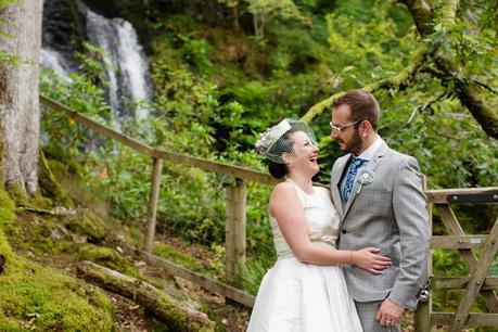 Weddings at Derwentwater Youth Hostel bride & groom in front of waterfall