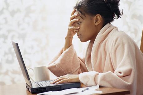 Frustrated Woman Using Laptop ca. 2002